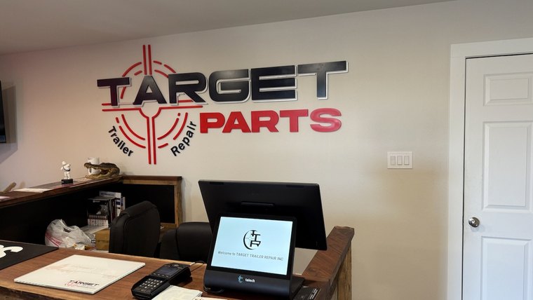 Office signage for a trailer repair shop
